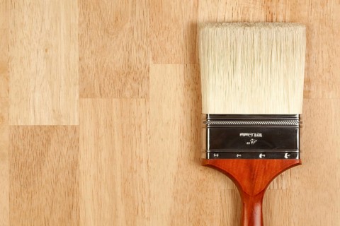 Paint Brush on a Wood Surface with Copy Room