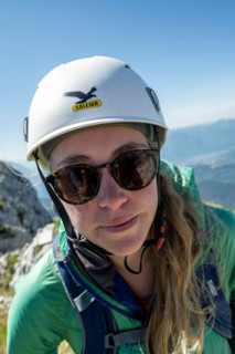 Mountaineer with helmet looks into the camera, Wetterstein Mountains, Bavaria, Germany