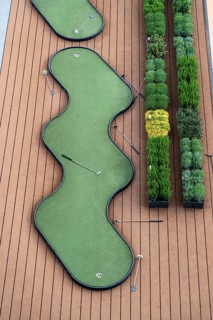 Outdoor deck, upper deck, open-air deck of a river cruise ship, putting green and shuffleboard game