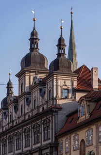 A intricate architectural details of Prague's historic buildings, showcasing classic spires and