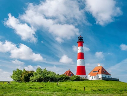 The Westerheversand lighthouse under a blue sky with white clouds, Westerhever, Eiderstedt