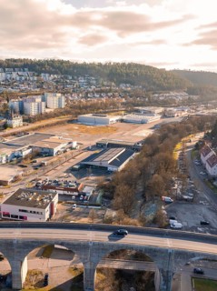 View of road over viaduct, with industrial areas and hills in the background, Nagold, Black Forest,