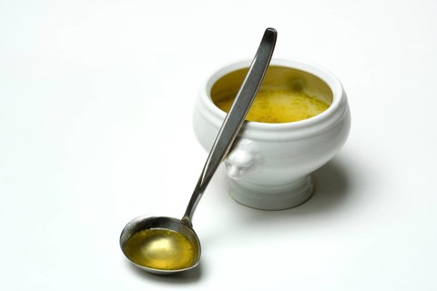 Bouillon, vegetable broth with ladle and bowl
