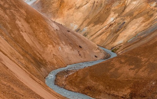 Steaming stream between colourful rhyolite mountains, Hveradalir geothermal area, Kerlingarfjöll,