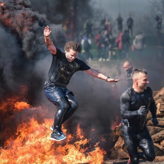 WROCLAW, POLAND - APRIL 7, 2018: Extreme running with obstacle RUNMAGEDDON. In the picture a runner