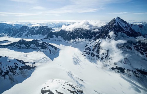 Snow and ice, epic mountains with glaciers, aerial view, Alaska Range, Denali National Park,