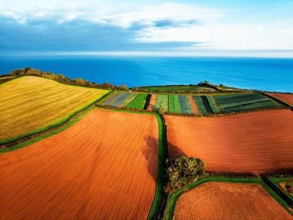 Colours of autumn Fields and Farms over Sheldon from a drone, Torbay, Devon, England, United