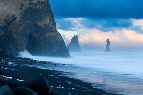 Reynisdrangar pinnacles, lava sandy beach, lava rocks, sea, waves, surf, sunset, Vik, Iceland,