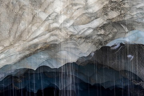 Meltwater at a glacier cave, underground glacier stream, Castner Glacier, Delta Range, Alaska