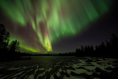 Northern Lights (Aurora borealis) over a frozen lake, Norrbotten, Lapland, Sweden, October 2022
