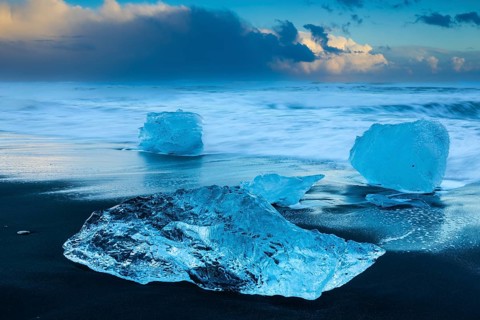 Ice chunks on the black beach, lava beach, glacier ice, sea, winter, sunset, Diamond Beach