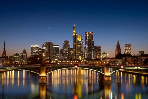 The lights of Frankfurt's banking skyline glow in the evening, Frankfurt am Main, Hesse, Germany