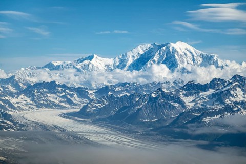 Clouds over high mountains, Mt Foraker with Kahlitna Glacier, aerial view, Alaska Range, Denali