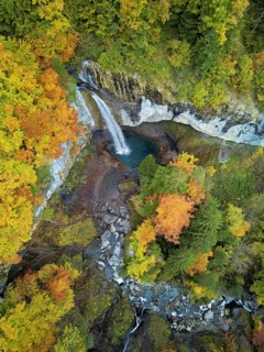 Aerial view of Berglistüber waterfall in autumn-colored surroundings, Linthal, Klausenpass, Canton