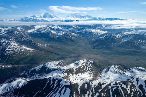 Clouds over high mountains, Mt Foraker and Mt Denali or Mount McKinley, aerial view, Alaska Range,