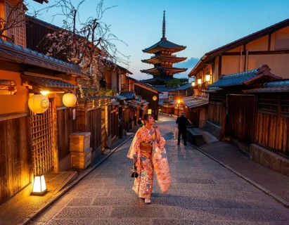 Japanese woman in kimono in an alley, Yasaka dori historic alleyway in the old town with