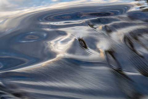 Waves in a stream, abstract, Norrbotten, Lapland, Sweden, August 2022