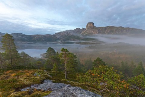 Magical morning fog on Steigtindvatnet in front of the majestic Steigtinden in Norway near Bodø