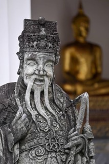 Stone statue of a Chinese warrior, guardian, Wat Pho, Temple of the Reclining Buddha, Bangkok,
