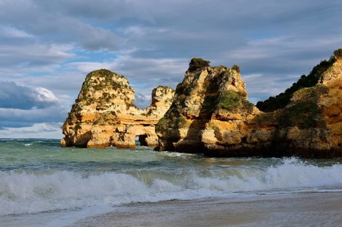 Rock formations on the coast in the evening light, Praia do Camilo, Lagos, Algarve, Portugal