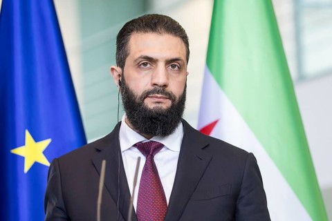 Ahmed al-Sharaa (President of the Syrian Arab Republic) at a joint press conference with Friedrich