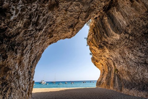 Rock cave on the beach at Cala Luna, Golfo di Orosei, Baunei, Sardinia, Italy