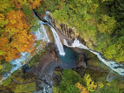 Aerial view of Berglistüber waterfall in autumn-colored surroundings, Linthal, Klausenpass, Canton