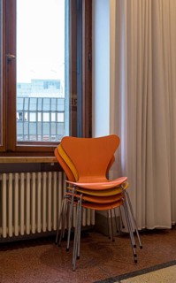 Colourful wooden chairs in the sixties style in a room in the Museum of Communication on Leipziger