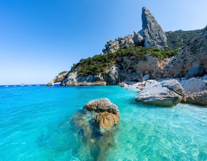 Light blue clear sea on a dream beach on Cala Goloritzé, picturesque rocky coast, steep coast with