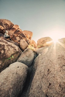 Woman hiking at sunrise in Joshua Tree National Park