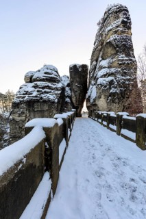 Snow on the Bastei bridge, rock gate and rock castle Neurathen in the morning, Saxon Switzerland,
