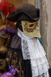 Venetian carnival costume in front of a shop, Venice, Veneto, Italy