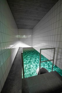 Long swimming pool with green water and white tiles, ENCW Netze Calw waterworks, Calw, Black