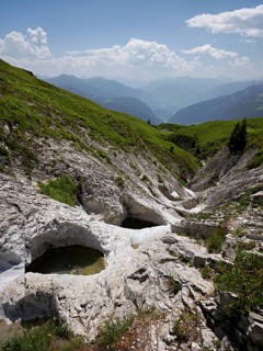 Glacier mill with glacier pots on the Trinser Alp Mora, Trin, Canton Graubünden, Switzerland