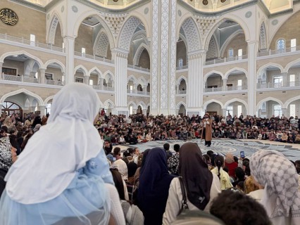 Dozens of Muslim children participate in indoor entertainment event inside a grand mosque during