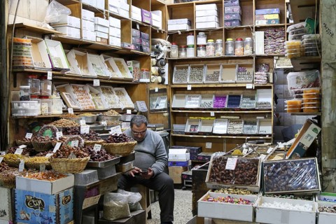 Syrians shop at the historic Al-Hamidiyah Bazaar adjacent to the Umayyad Mosque during the early