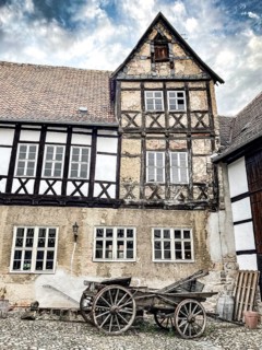 Part of west wing of historic aristocratic farm Fleischhof with restored 16th century half-timbered