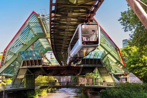 A suspension railway leaves the Kluse stop, Wuppertal, Germany