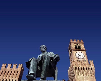 Verdi monument in front of Rocca dei Marchesi Pallavicino, now the city hall, with Teatro Giuseppe
