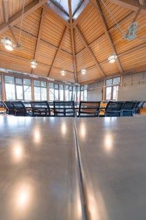 Modern conference room with wooden interior and hanging lights, plenty of daylight, Nagold Town