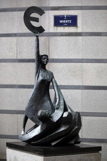 The bronze statue entitled Europe by May Claerhout holds up the euro symbol, Rue Wiertz, European