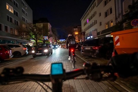 Cycling in the city, in the dark, in the evening, inner-city road, bicycle road, two-wheeler