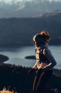 Trail running in autumn on the Jochberg on Lake Walchensee against the wonderful backdrop of the