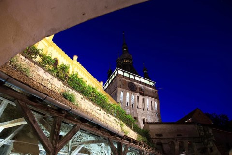Romania, hour tower at the blue hour in the historic old town of Sighisoara, German Sighisoara,