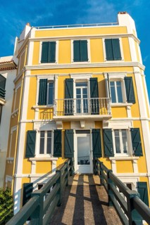 The beautiful buildings of the Grande Plage in Saint Jean de Luz at sunset, vacation in the south