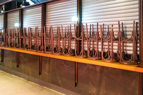 High bar hoickers and closed market stalls in the Mercat de la Boqueria, famous market on the