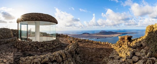 Stairway and viewing platform at the Mirador del Río viewpoint, in the evening light with sun