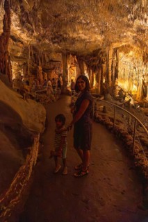 Mother and child enjoying a guided tour inside the amazing caves of drach in porto cristo,