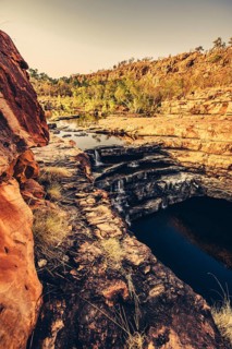Bell Gorge waterfall, a body of water in north-west Australia in the Kimberley. Sunrise in the
