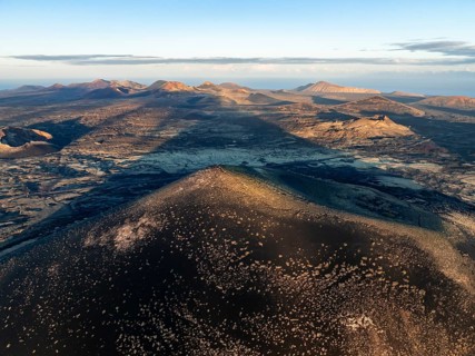 Picturesque volcanic landscape with volcanic craters and lava fields in morning light, Montaña